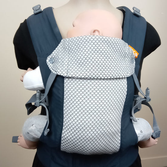 Demo doll in a navy cool mesh Beco Gemini baby carrier