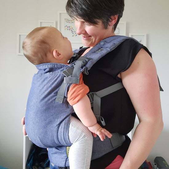Auckland based babywearing educator Sarah wearing an infant in a Chambray Boba X