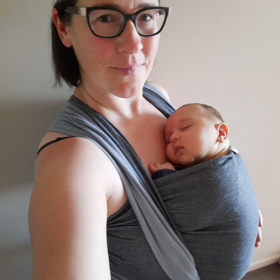 Auckland babywearing educator Sarah wearing her newborn son in a front wrap cross carry
