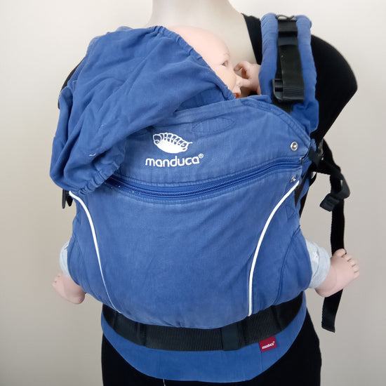 Blue Manduca with back panel zipped down being worn by a mannequin