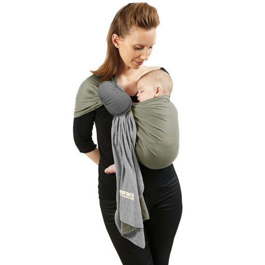 Woman looking down at a sleeping baby in an olive and grey love radius wrap without a knot